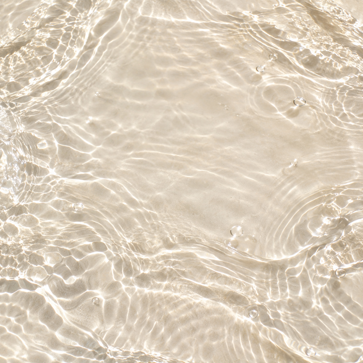 Abstract clear water ripples over a warm ivory background